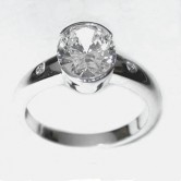 18ct white gold ring set with an oval cut diamond